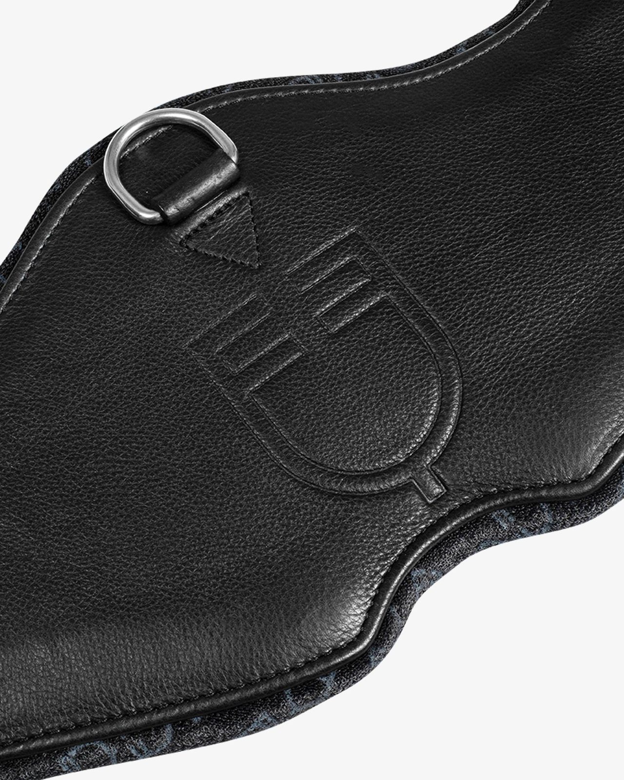 Shaped dressage girth in leather with engraved logo