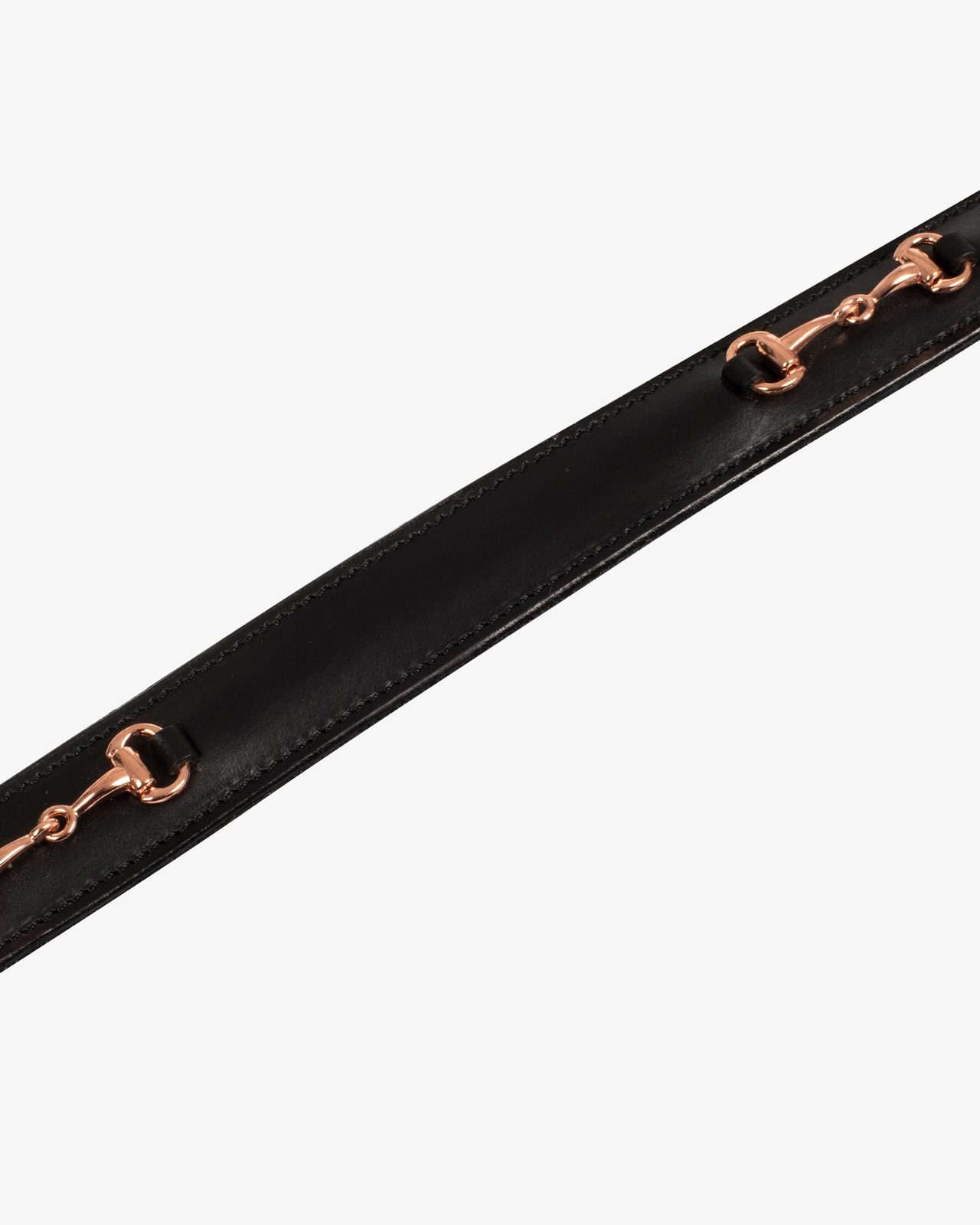 English belt with rose gold snaffle bits