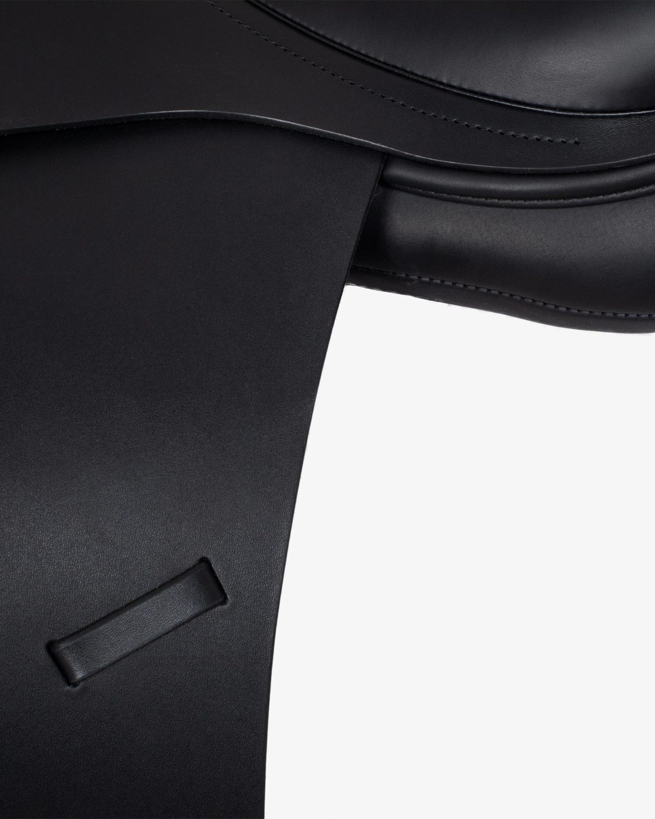 Dressage saddle with removable blocks