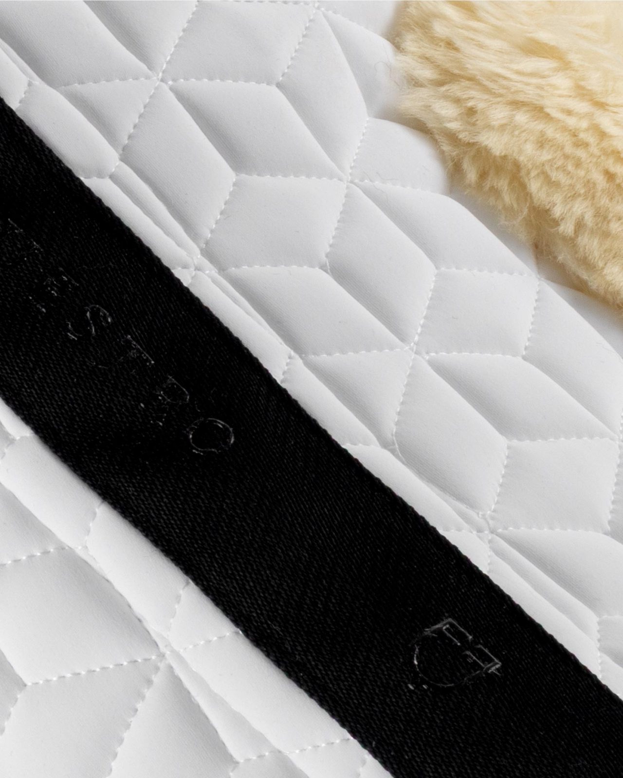 Technical fabric pad with sheepskin