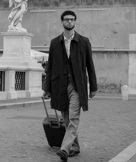 boy-with-trolley-across-ponte-sant-angelo-roma