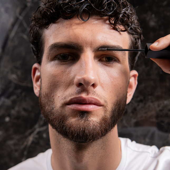 model-shows-how-to-use-be-bushy-brow-mascara-transparent-on-beard-by-brushing-it
