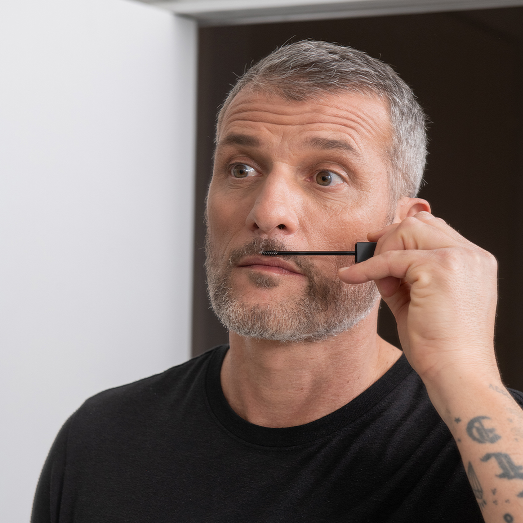 model-applies-bb-skill-be-bushy-brow-mascara-transparent-above-the-moustache