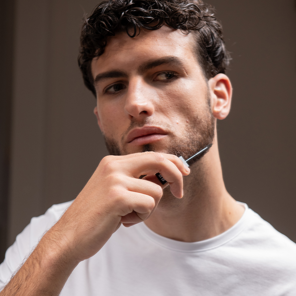 young-model-uses-be-bushy-brow-mascara-transparent-on-beard
