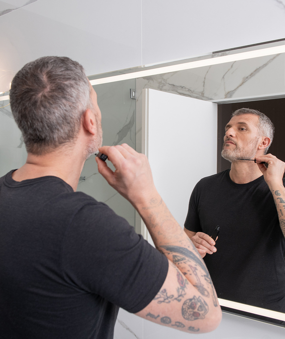 model-uses-be-bushy-brow-mascara-transparent-on-beard