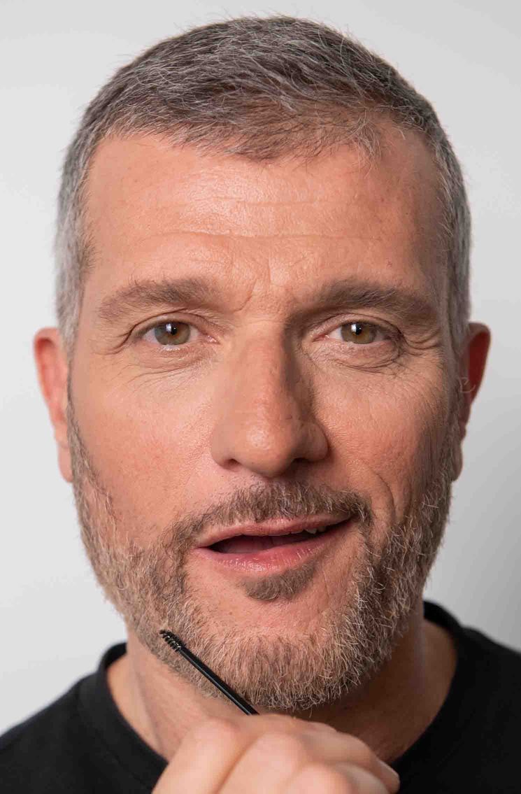 man-applying-be-bushy-transparent-mascara-transparent-beard