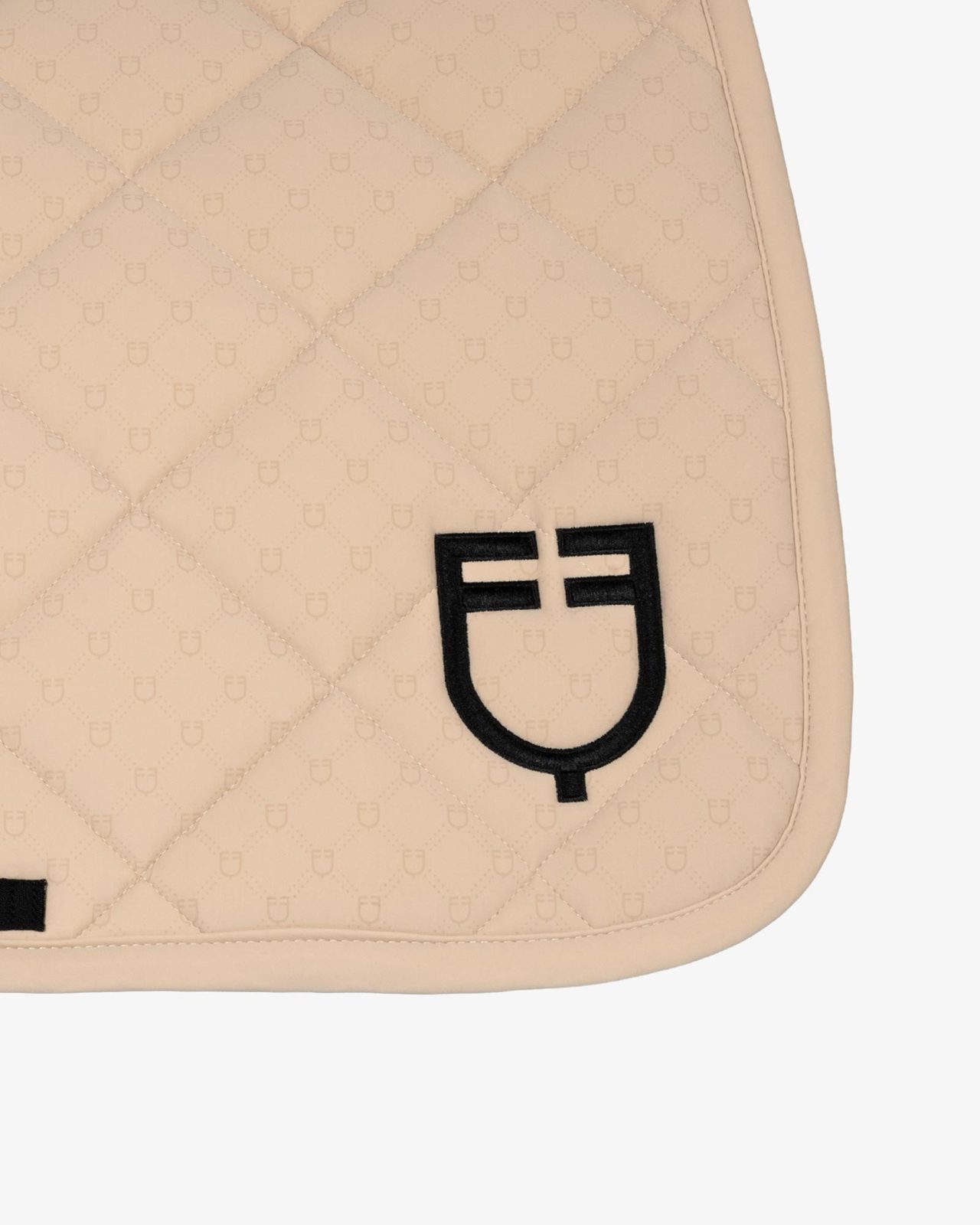 Jumping saddle pad with monogram print