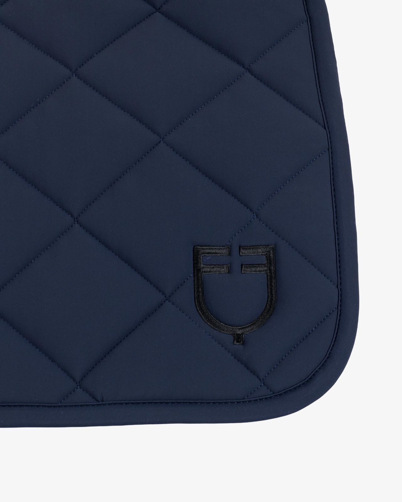 Jumping saddle pad with diamond quilting and embroidered logo