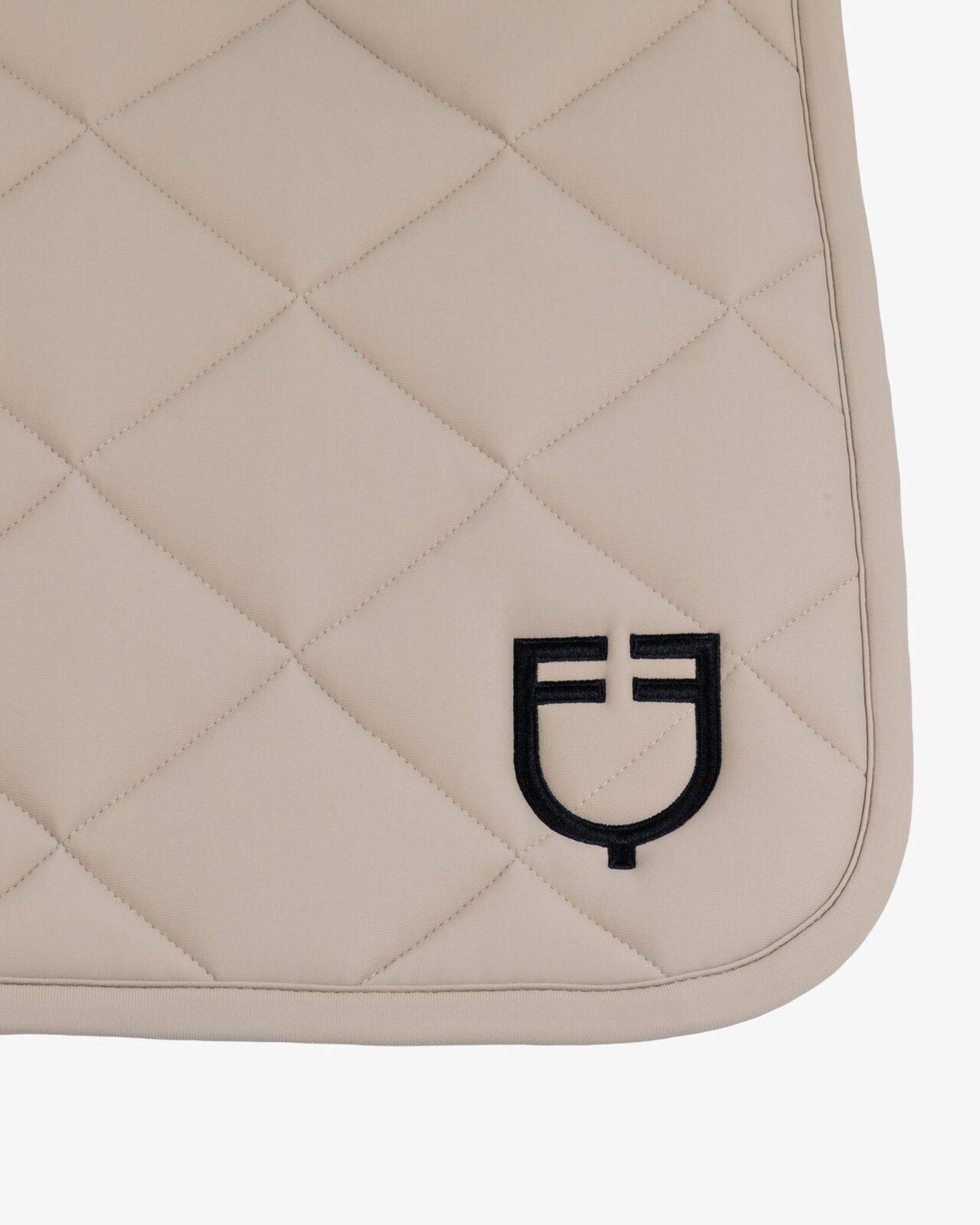 Jumping saddle pad with diamond quilting and embroidered logo